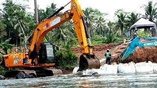 EXCAVATOR JCB - digging stones in the river