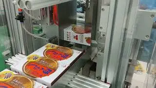 Oushida semi-automatic carton sealing machine applies glue to food boxes.