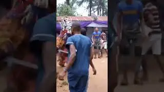 Masquerade chasing people in Africa