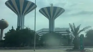 Balloid water tower next to Kuwait water towers up close