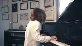 Seven-year-old Greek piano prodigy pens an 'isolation waltz'