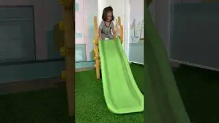 Alvaro plays on the slide at Mitra 10