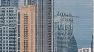 Panoramic skyline of Dubai with business bay and downtown district timelapse.