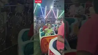 Little adventurer on her magical dragon ride 🐉✨ Pure joy in every turn! 💖🎡#FunFairVibes
