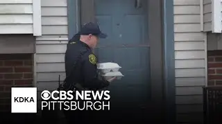 Pittsburgh police officers pass out Thanksgiving meals to those in need