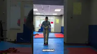 Physical therapy for the shoulder joint with a rubber band and kettlebell