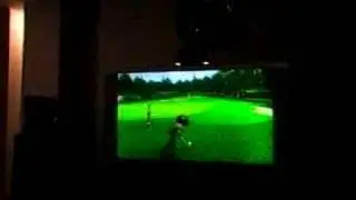 Macedin playing golf on the wii