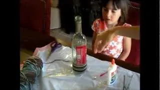 How To Upcycle a Wine Bottle into a Yarn Wrapped Vase