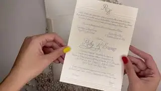 Sophisticated embossed silver foil Monogram invitation on ivory shimmery cardstock card & envelope.