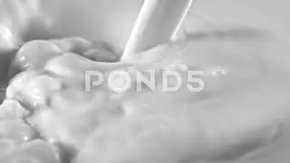 Pouring fresh milk in super slow motion, shooted with high speed cinema camera at 1000fps 4K.