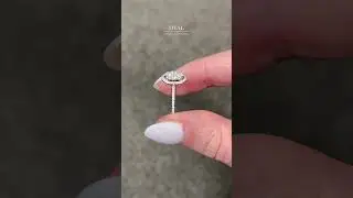 Stunning oval engagement ring with micro set shoulders and diamond halo