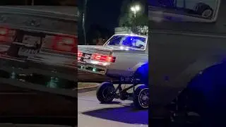 Buick Regal G Body LOWRIDER TIPPING in 3 wheel motion, then dropping back down low!