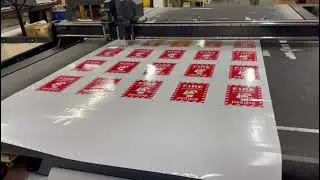 Method of Printing and Slicing Custom Vinyl Adhesive Banners at AGAS Manufacturing Group.