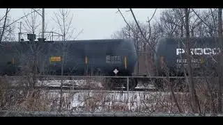 CN L551 EMD GP38-2 4910 & GP9RM 4125 are switching Tank cars in the Glasslead Industrial Spur 