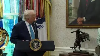 President Donald Trump answers reporter questions after swearing in SEC chairman