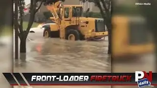 Front-Loader Plays Firetruck To Help An On Fire Car In Flood Waters