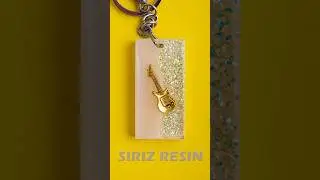 Glowing Resin keychain with a guitar trapped🎸 inside  #epoxyresin #epoxy #resinart #resincrafts
