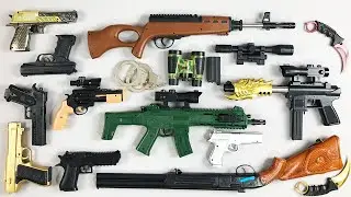 On the table Toy Guns ! Karambits - Weapons - Handcuffs - Binoculars