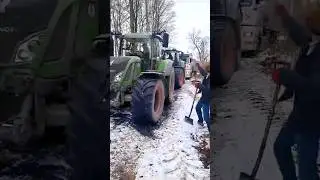 Two Fendts removing a stuck truck.