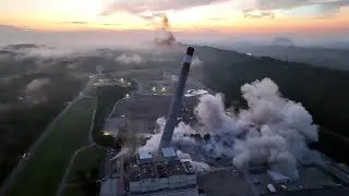 Industrial chimneys crash down in controlled demolition