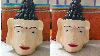 Pista shell and plastic bottle with Buddha statue craft