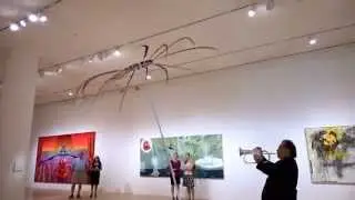 Jazz musician John Worley improvises to a kinetic sculpture by Alan Rath