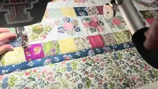 Simple custom quilting on busy prints