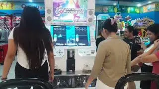 The Girls playing DDR