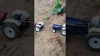 Tractor pulling tractor trolley with JCB loded