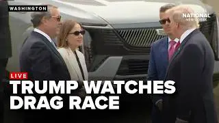 President Trump watches a drag race during a trip to General Motors in Michigan