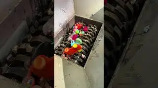Waste plastic toys are poured into a twinshaft shredder and crushed#How much is a shredder