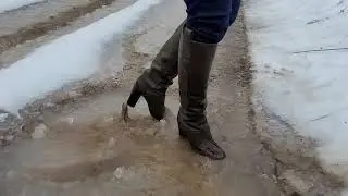 High heel leather boots in mud snow and puddles