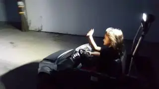April Sixtos riding in her power wheels with an led light bar