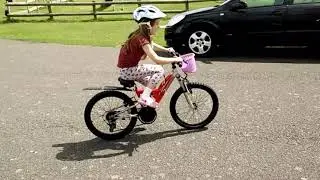 Abby riding with safety gear