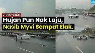 KERETA MEWAH LAJU DALAM HUJAN.