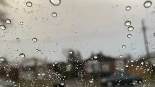 Morning rain drops out the window and it block the view but makes it better