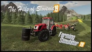 Preparing the grass for baling in The Hills of Slovenia