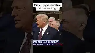 New Mexico rep holds protest sign as Trump enters Congress