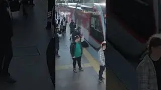 Hair-raising moment security guard saves woman from oncoming tram just in time