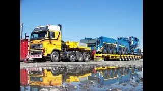 Heavy transport Mega Machines Carrying Trucks