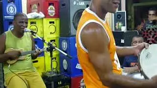 Girls dancing samba in Rio de Janeiro pub, guys playing real Samba music, Brazil