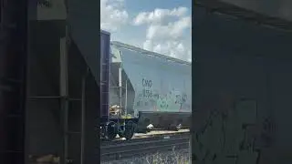 The hopper car started dumping grain on the track!!!