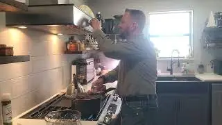 Coffee roasting on the stove top with a popcorn popper.
