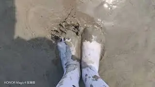 Muddy Jordan 23 White crew socks on muddy beach