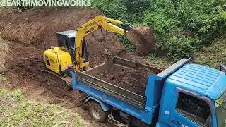 Komatsu PC56-7 Excavator and Fuso 4m50 Fighter Working Together on Excavation and Hauling Job