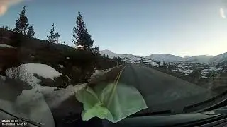 Dashcam footage of drive to Cairngorm mountain resort with snow beside road