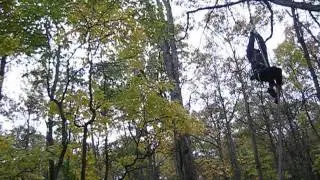 Jessica jumping off the Tarzan Rope, #2 - at Tree Tops Adventure Course