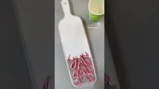 Artist makes a resin serving board with candy canes for the holiday season!
