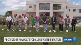 Protestors advocate for clean water practices outside groundbreaking event with Gov. Kim Reynolds