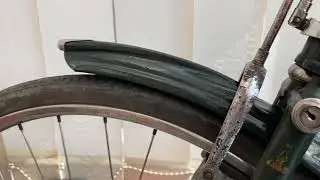 Oiling Raleigh Industries head bearings on a classic bicycle.